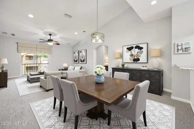 an empty room with a ceiling fan and window