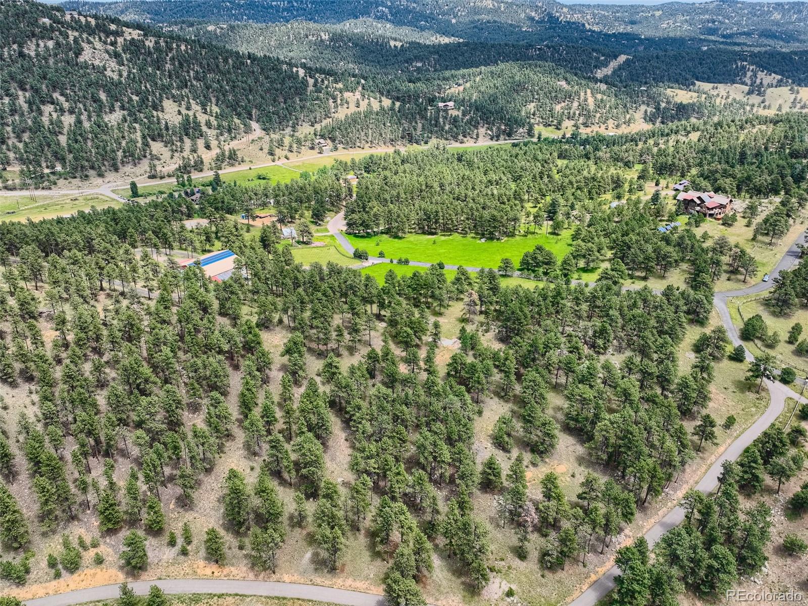 2117 Wieler Road Evergreen, CO 80439 - Photo 12 of 40 a view of a garden with a lake