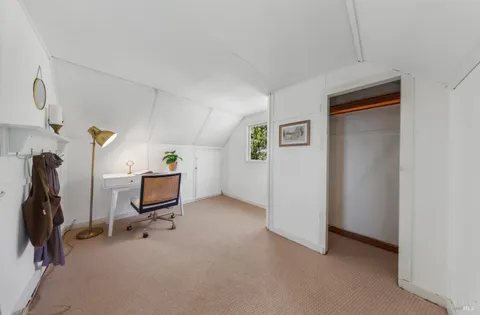 a view of a livingroom with furniture and a livingroom