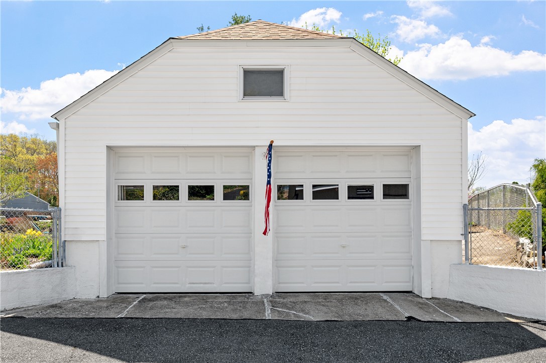 73 Mowry Street Woonsocket, RI 02895 - Photo 23 of 34 Spacious 2 car detached garage. Plenty of extra space in front of vehicle for storage.