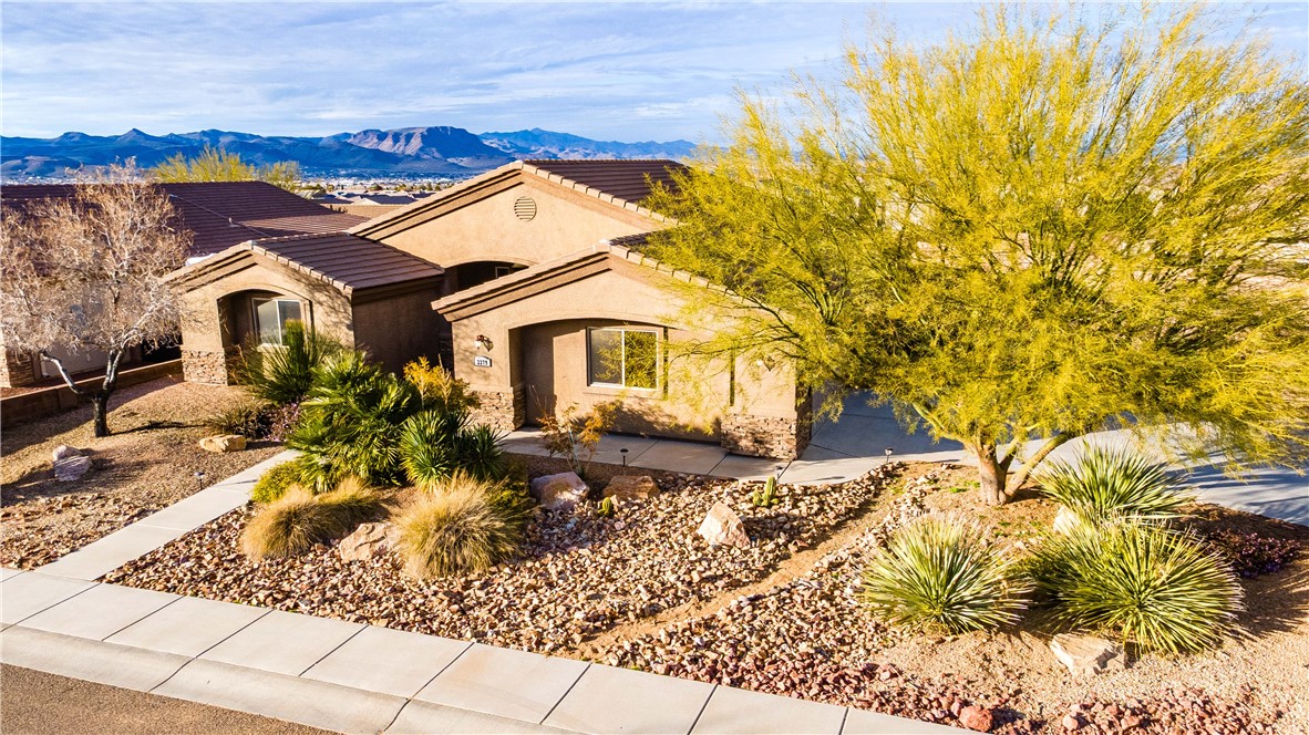 3379 Motherload Road Kingman, AZ 86401 - Photo 1 of 67 View of front facade with a mountain view, stucco siding, and a tiled roof