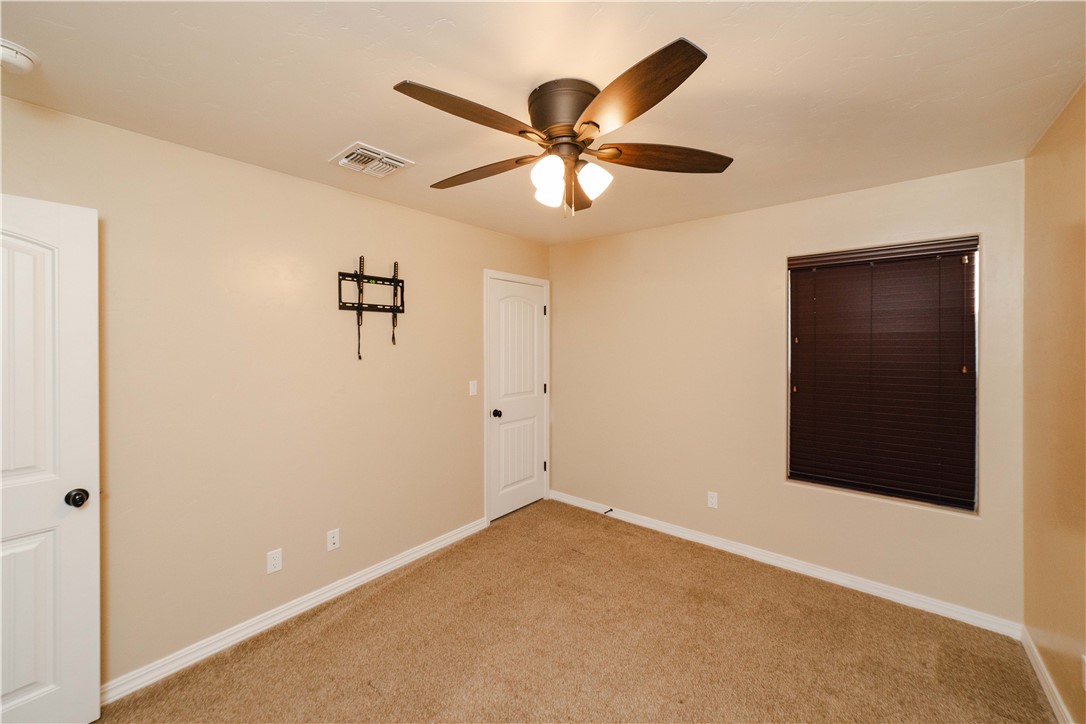 3379 Motherload Road Kingman, AZ 86401 - Photo 31 of 67 Carpeted empty room featuring baseboards and a ceiling fan
