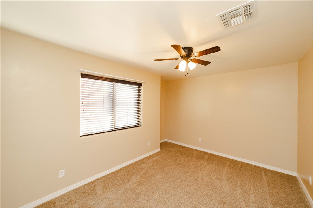 3379 Motherload Road Kingman, AZ 86401 - Photo 35 of 67 Unfurnished room featuring light carpet and a ceiling fan