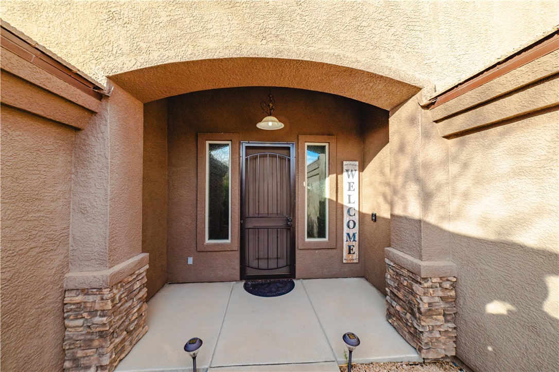 3379 Motherload Road Kingman, AZ 86401 - Photo 4 of 67 Entrance to property featuring stucco siding and stone siding