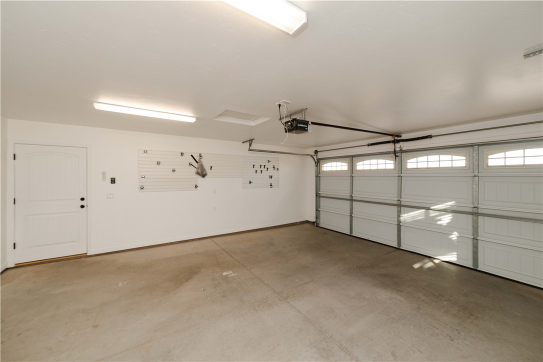 3379 Motherload Road Kingman, AZ 86401 - Photo 43 of 67 Garage featuring a garage door opener