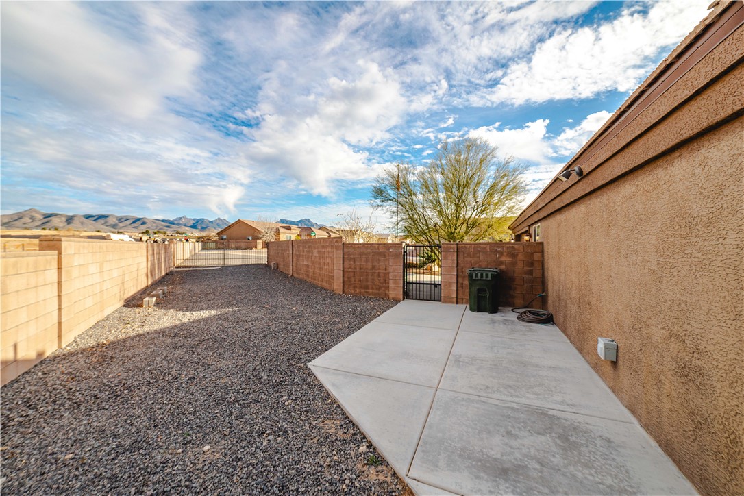 3379 Motherload Road Kingman, AZ 86401 - Photo 48 of 67 Fenced backyard with a patio and a gate