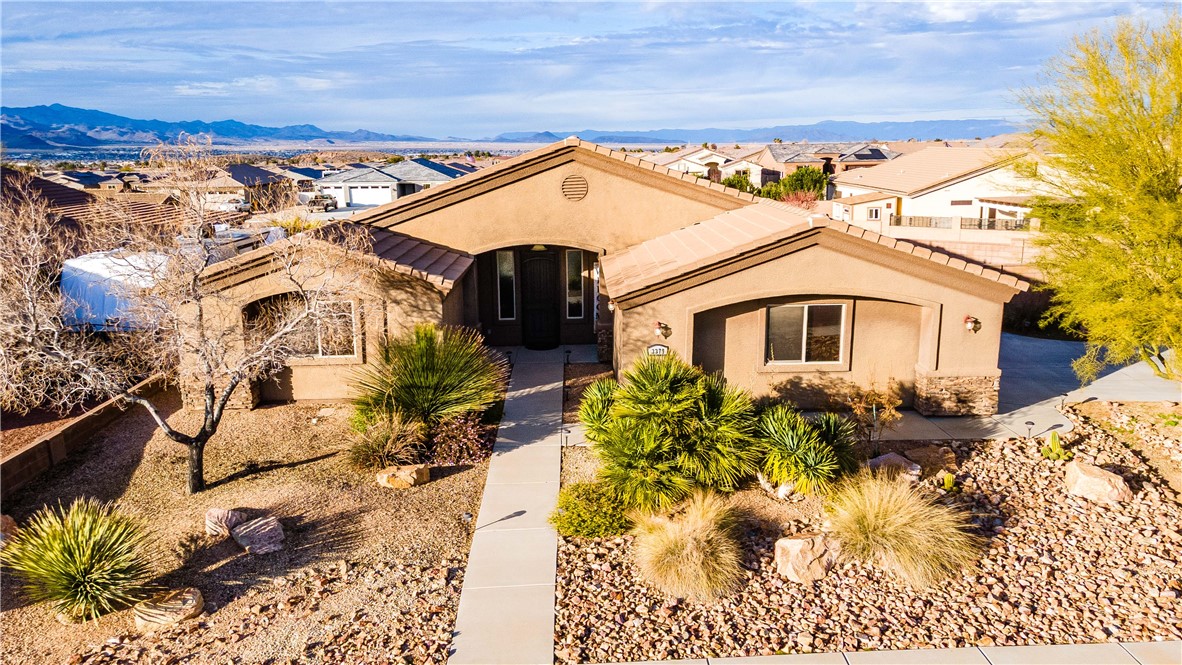 3379 Motherload Road Kingman, AZ 86401 - Photo 58 of 67 Mediterranean / spanish home featuring stucco siding, a residential view, and stone siding