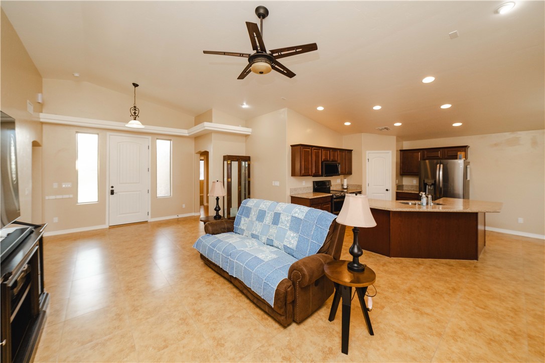 3379 Motherload Road Kingman, AZ 86401 - Photo 6 of 67 Living area with a ceiling fan, vaulted ceiling, and recessed lighting