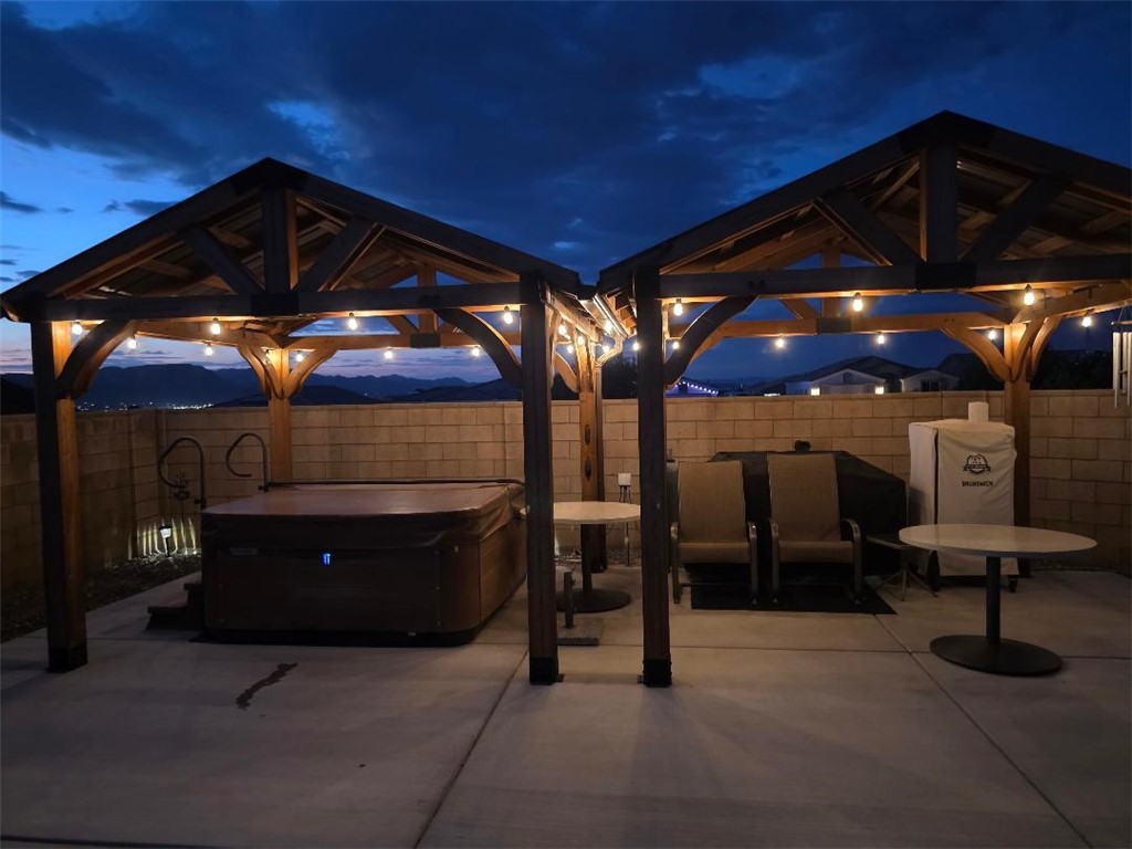 3379 Motherload Road Kingman, AZ 86401 - Photo 64 of 67 Fenced backyard featuring a patio area and Bullfrog spa