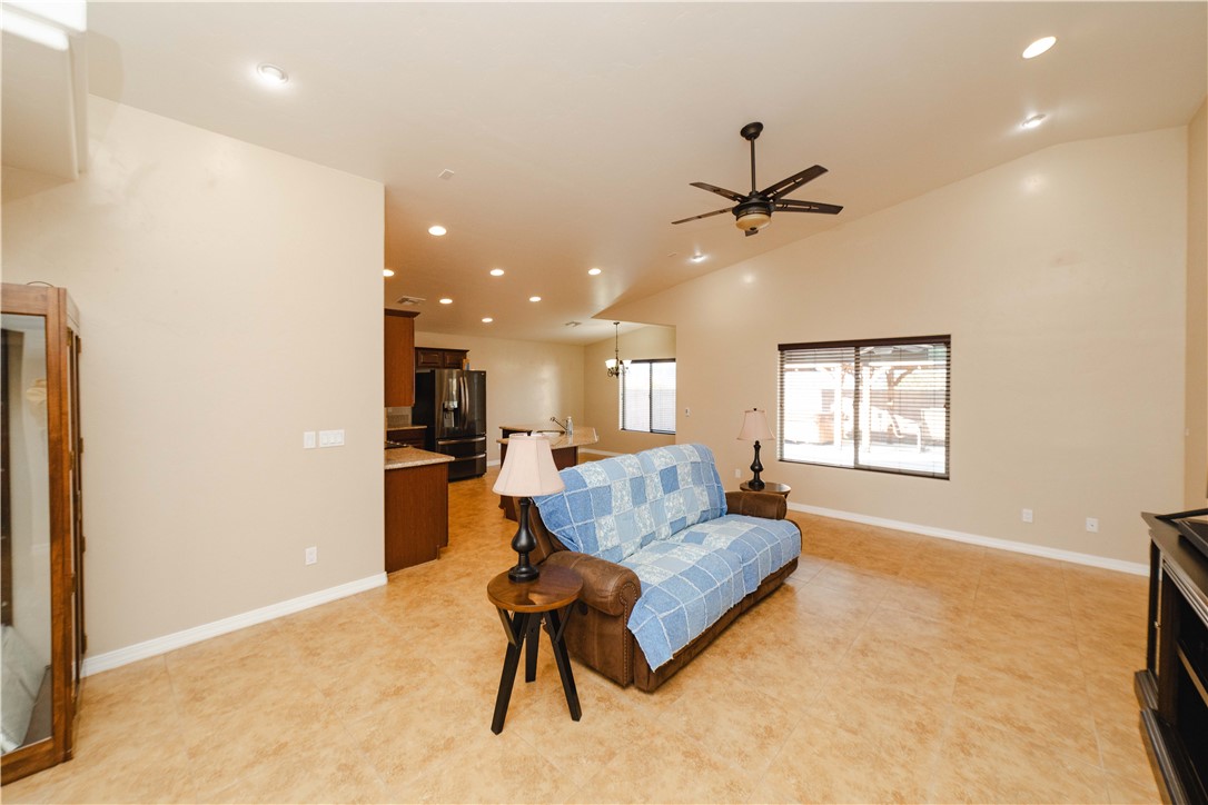 3379 Motherload Road Kingman, AZ 86401 - Photo 7 of 67 Living area with recessed lighting, ceiling fan, and vaulted ceiling