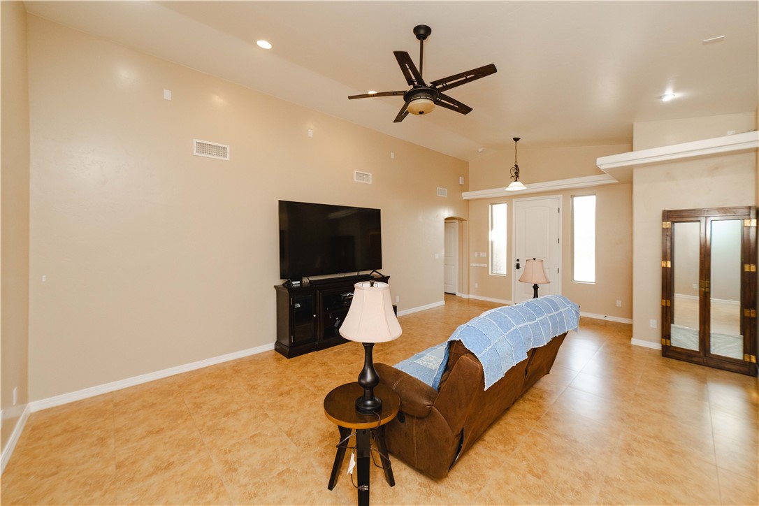 3379 Motherload Road Kingman, AZ 86401 - Photo 8 of 67 Living room with ceiling fan, recessed lighting, and high vaulted ceiling