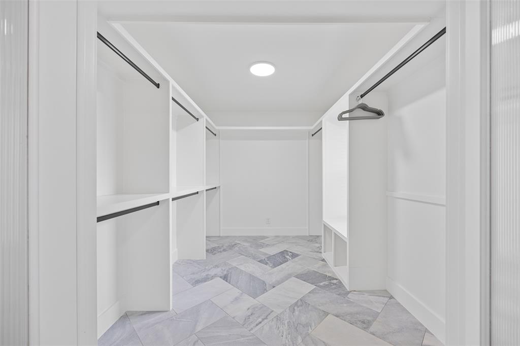 4419 Sexton Lane Dallas, TX 75229 - Photo 12 of 24 Walk in closet with light marble finish flooring