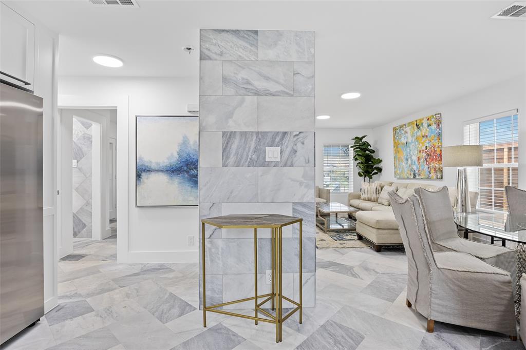 4419 Sexton Lane Dallas, TX 75229 - Photo 9 of 24 Living room featuring healthy amount of natural light and light marble finish floors