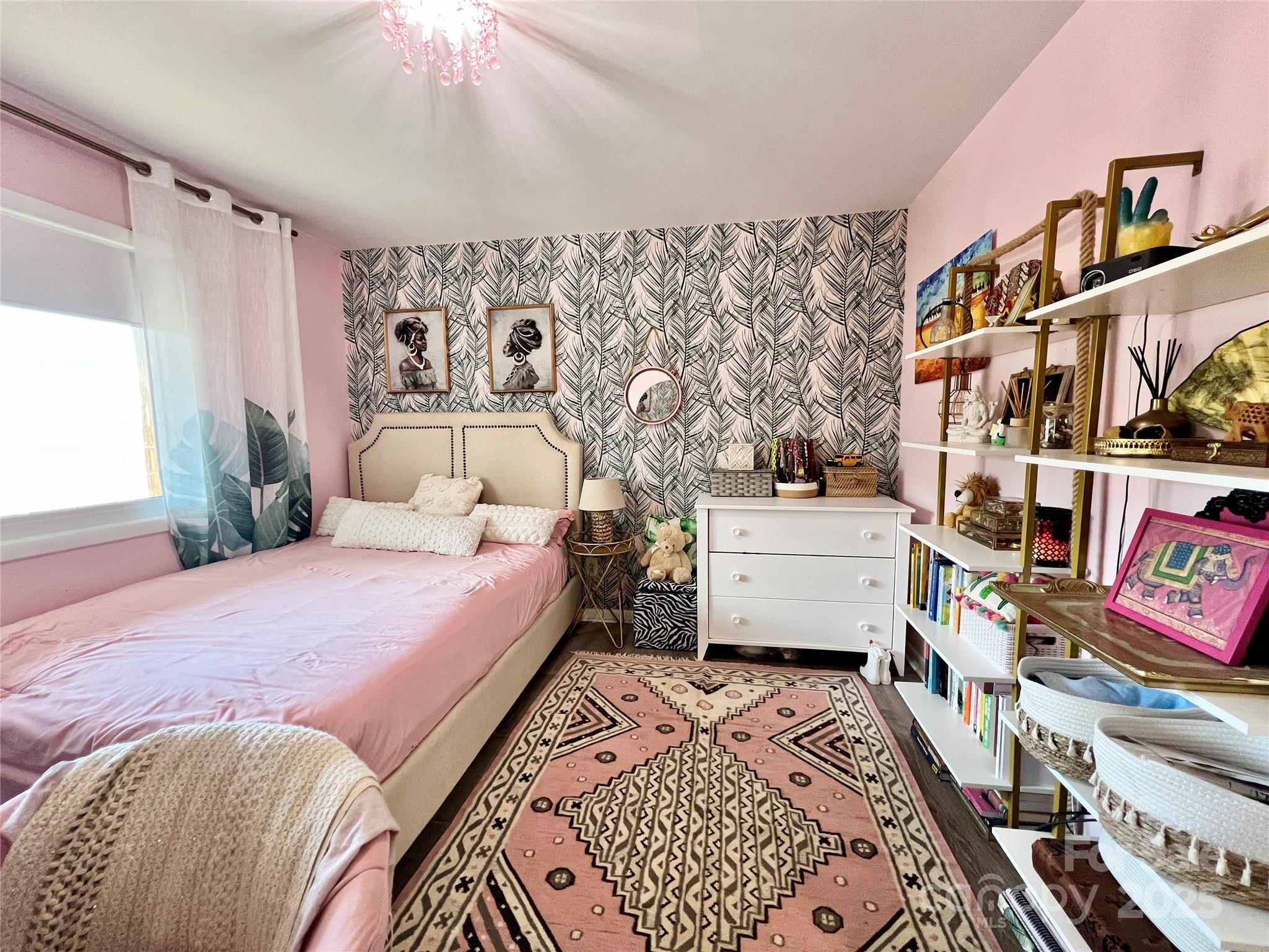 9009 Cebu Court Fort Mill, SC 29708 - Photo 15 of 35 a bedroom with a bed and a book shelf