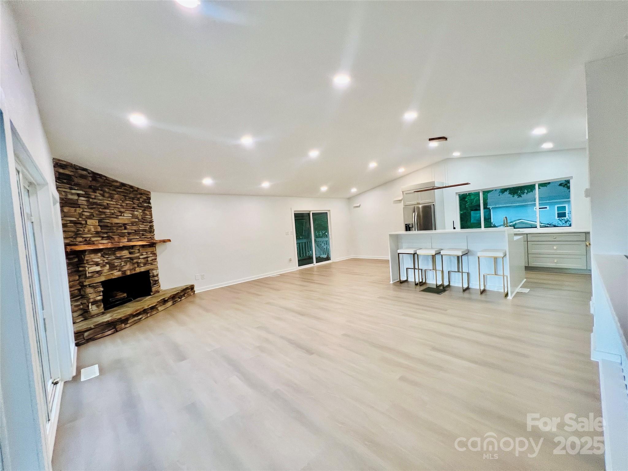 9009 Cebu Court Fort Mill, SC 29708 - Photo 23 of 35 a view of an empty room with a kitchen