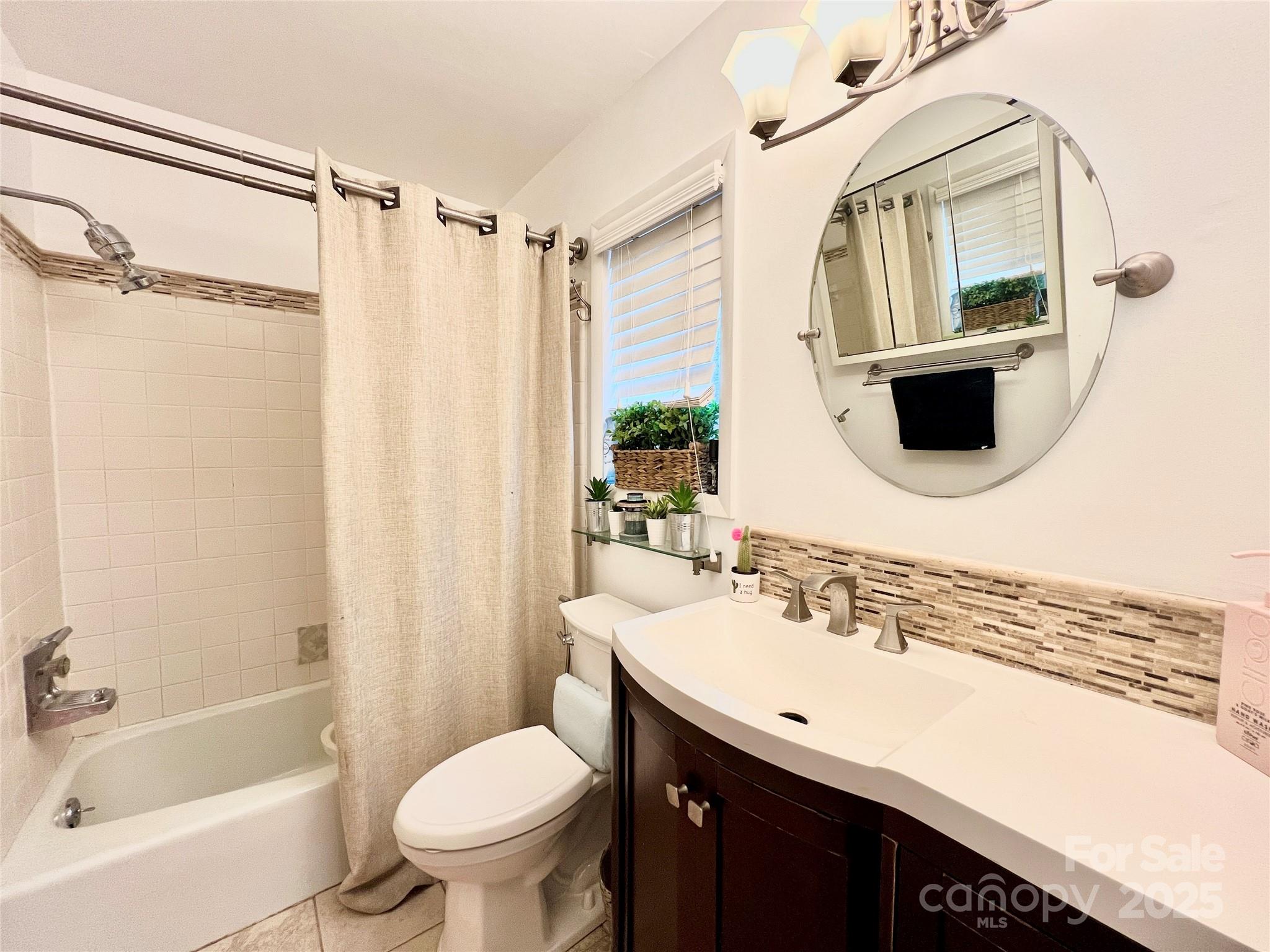 9009 Cebu Court Fort Mill, SC 29708 - Photo 26 of 35 a bathroom with a sink toilet and shower