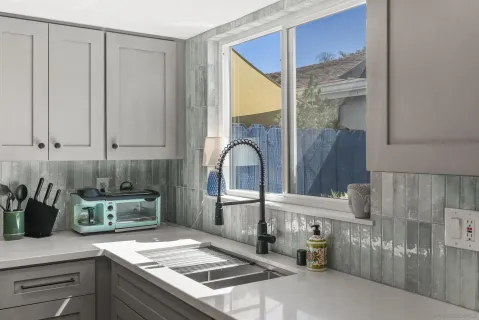 a kitchen with a sink and cabinets