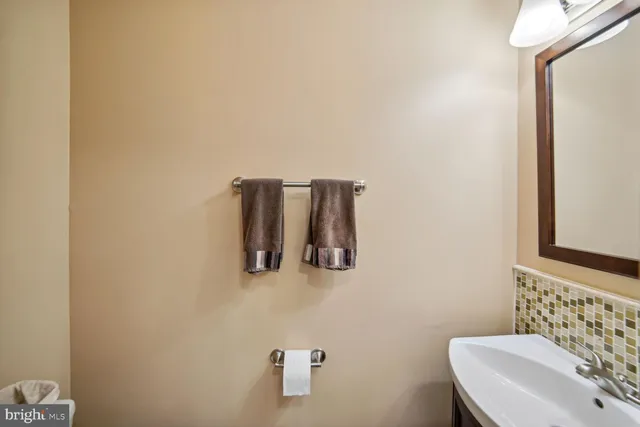 a bathroom with a sink and mirror