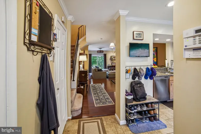 a view of a hallway with living room and furniture