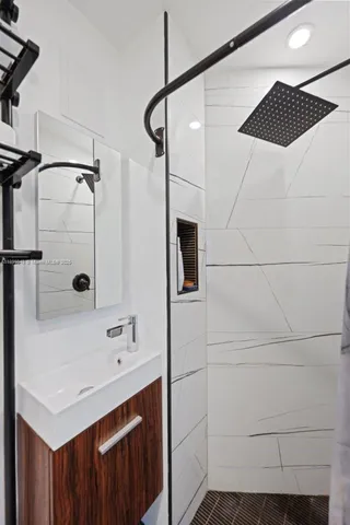 a bathroom with a sink and a mirror