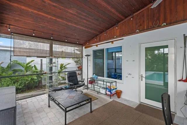 a outdoor space with patio the couches and a potted plant with outer view