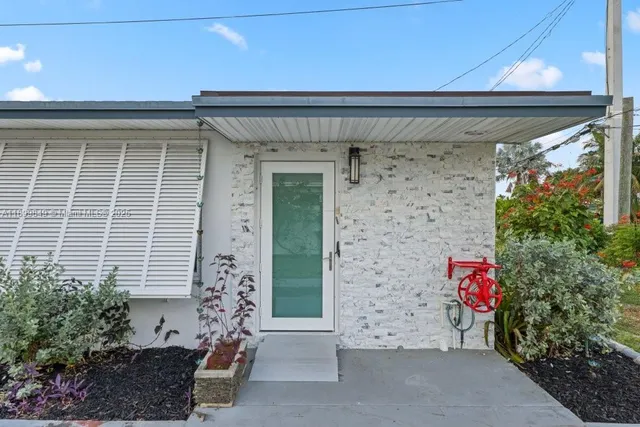 a front view of a house with outdoor space