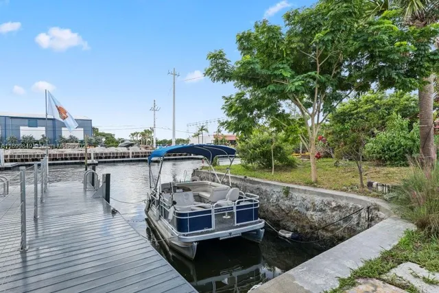 a view of a lake with boats and trees in the background