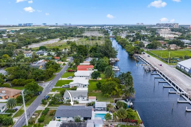 an aerial view of a house with a lake view