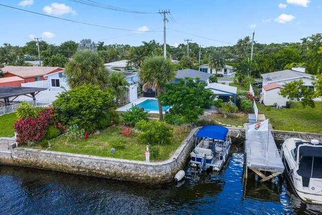 a view of a wooden chairs and bench in the terrace