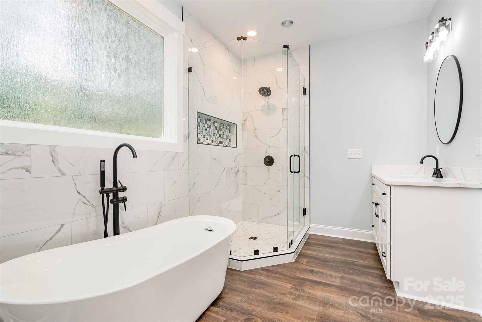 129 John Smith Road Clover, SC 29710 - Photo 16 of 29 a bathroom with a tub a sink and mirror