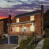 a front view of a house with yard