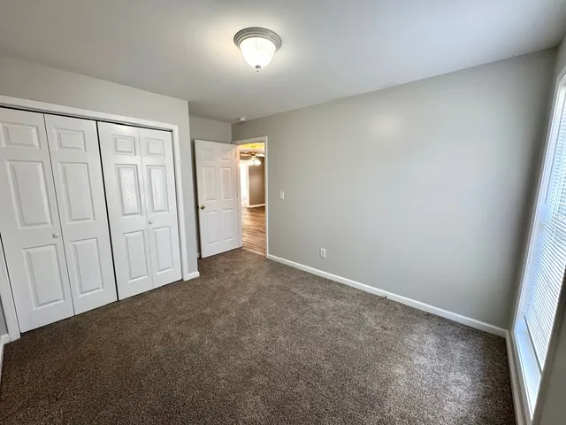 an empty room with closet area