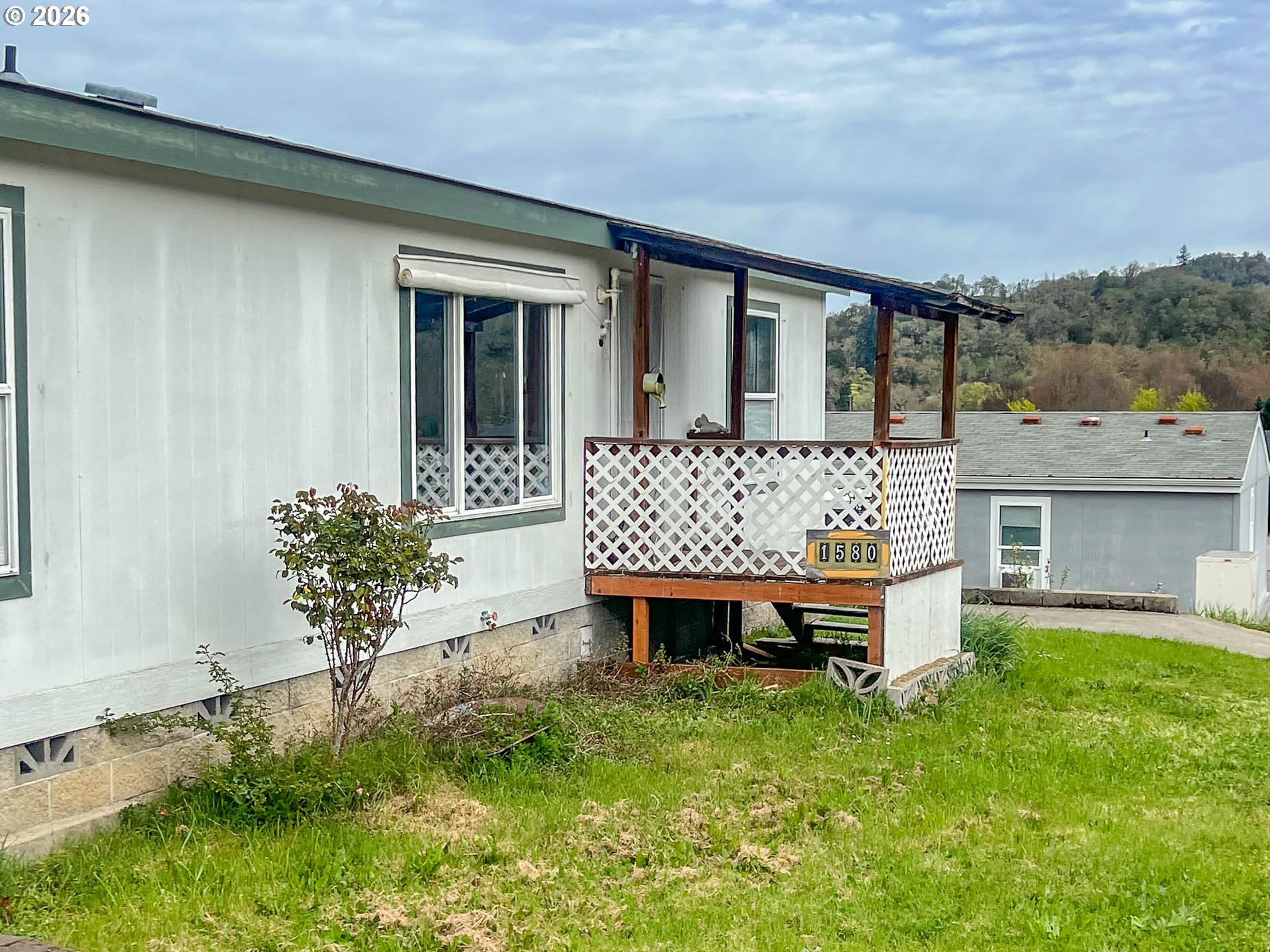 1580 Winston Section Road Winston, OR 97496 - Photo 3 of 11 a view of a house with backyard and sitting area