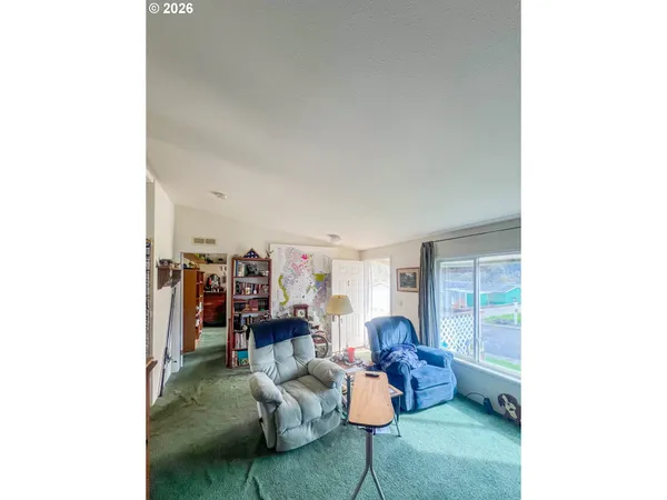 a living room with furniture and a table