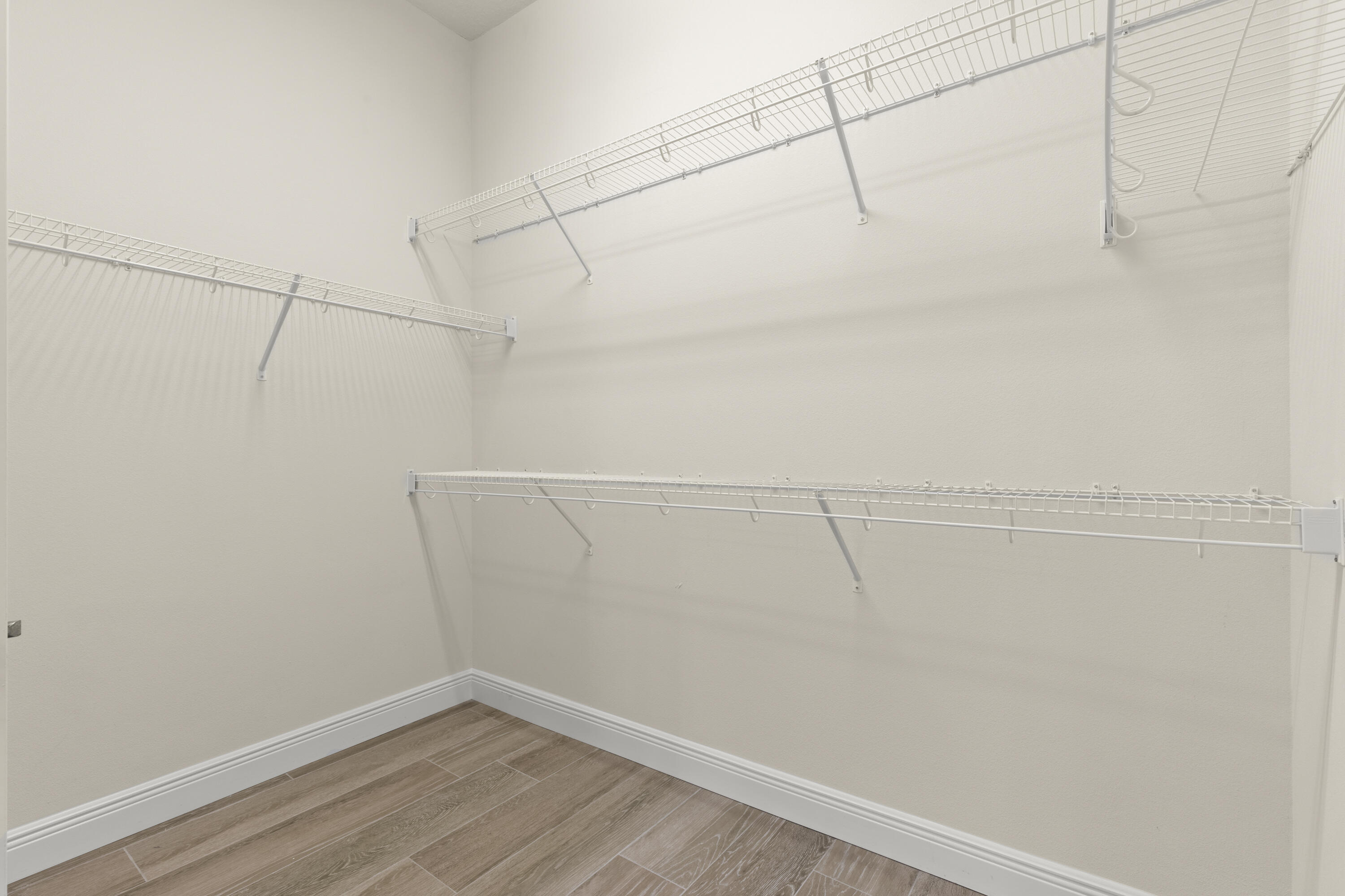 7065 Primavera Lane Melbourne, FL 32940 - Photo 17 of 40 a view of a room with racks on the wall