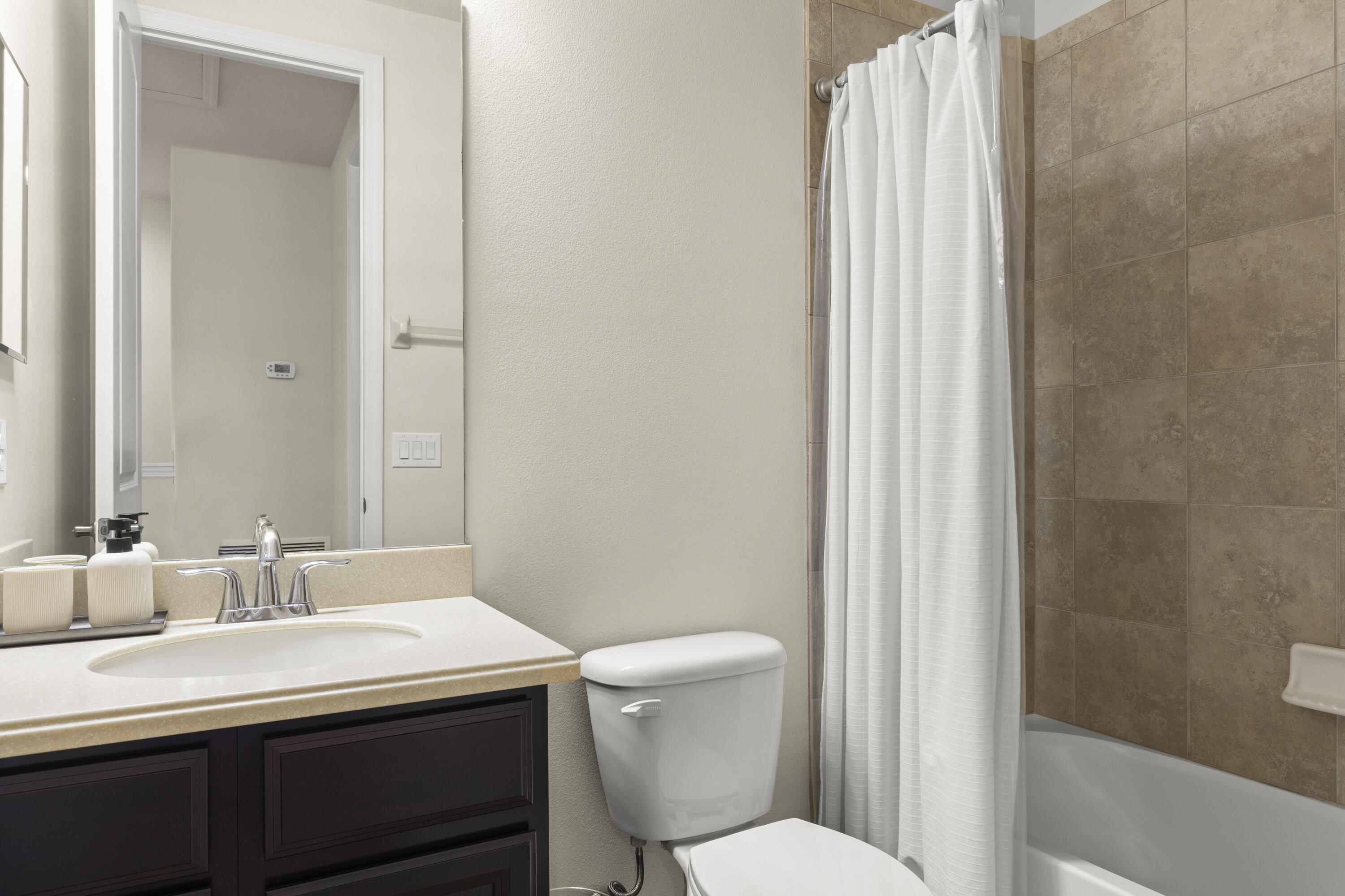 7065 Primavera Lane Melbourne, FL 32940 - Photo 23 of 40 a bathroom with a sink toilet and shower