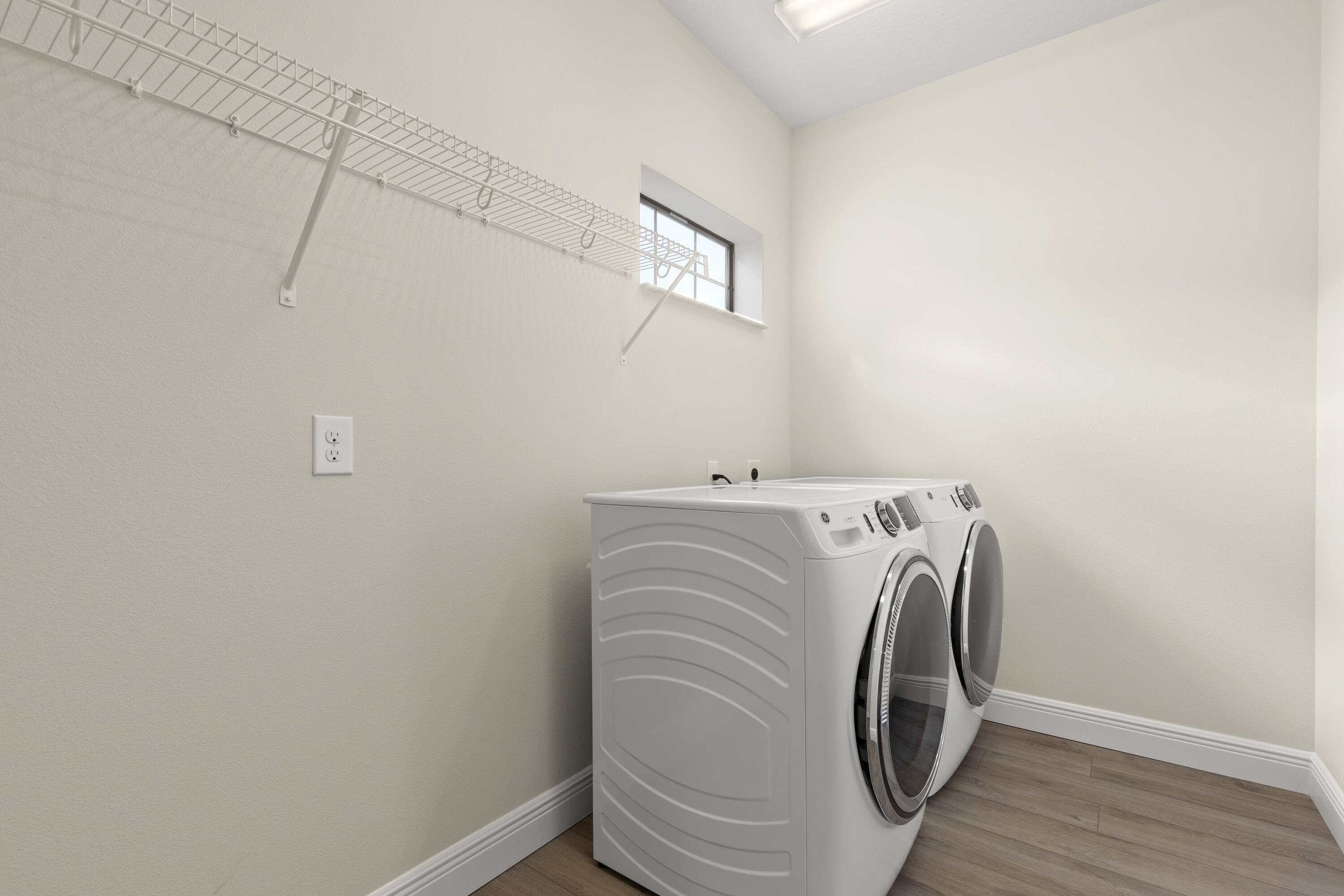 7065 Primavera Lane Melbourne, FL 32940 - Photo 25 of 40 a view of a storage & utility room with a washer dryer