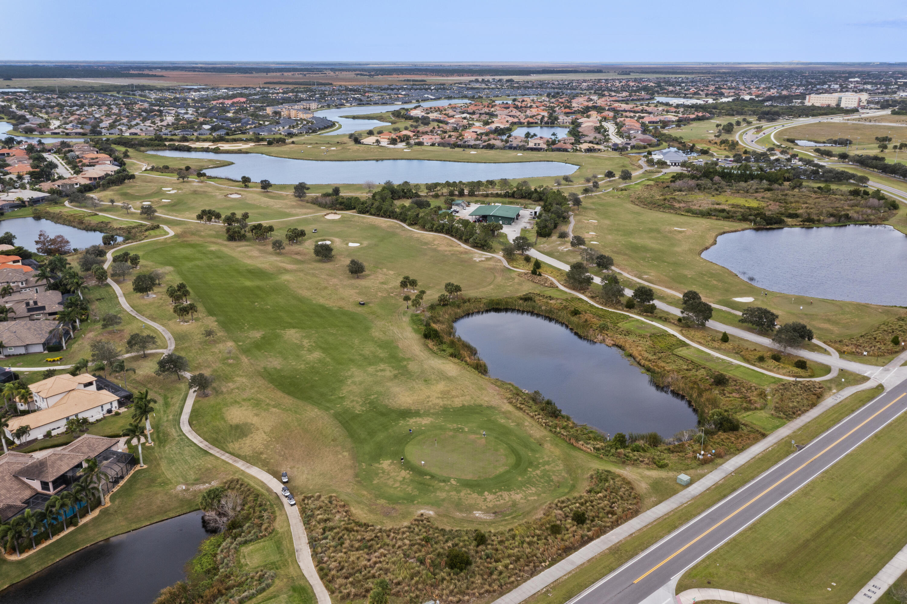 7065 Primavera Lane Melbourne, FL 32940 - Photo 30 of 40 an aerial view of residential houses with outdoor space