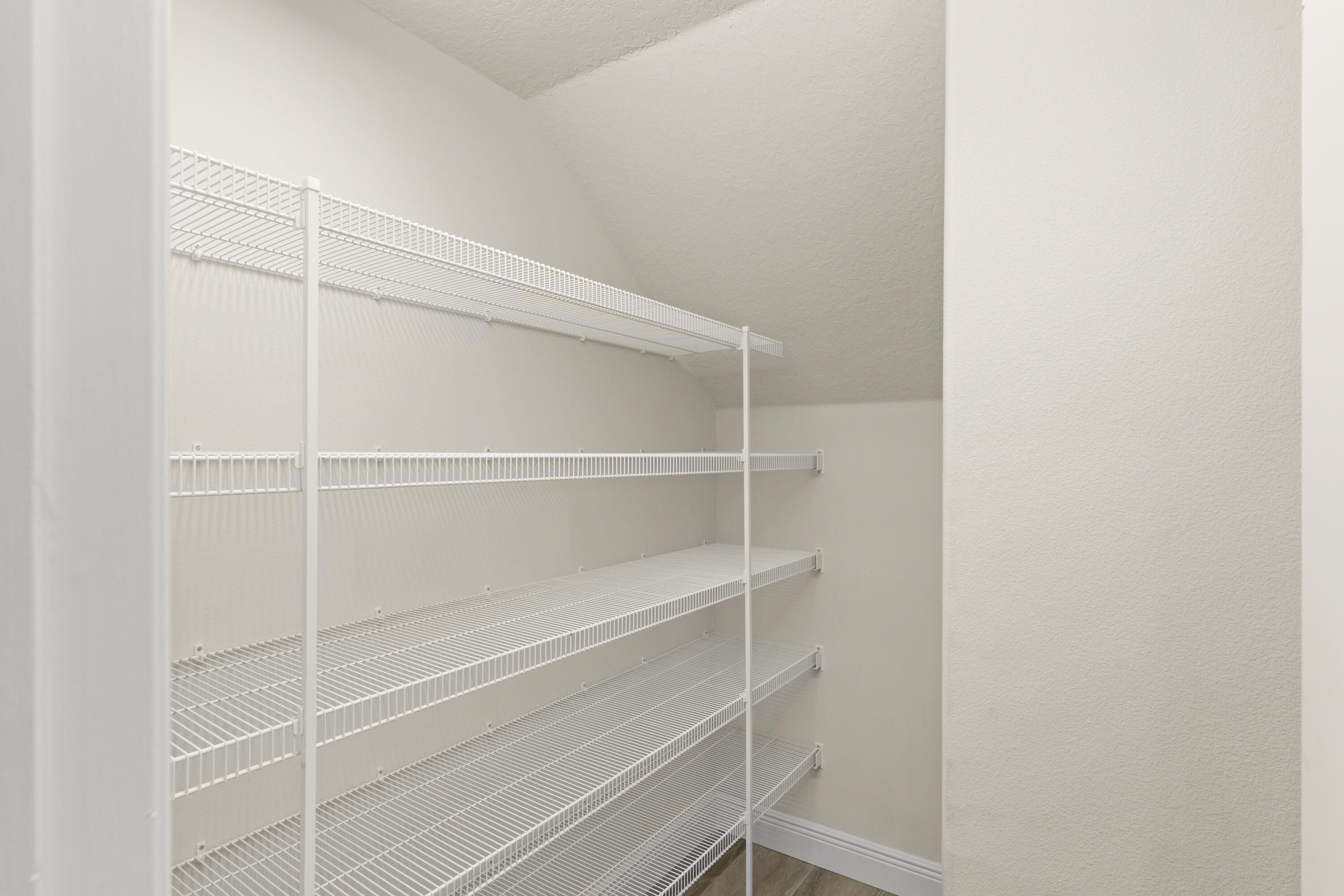 7065 Primavera Lane Melbourne, FL 32940 - Photo 10 of 40 a view of walk in closet with empty racks