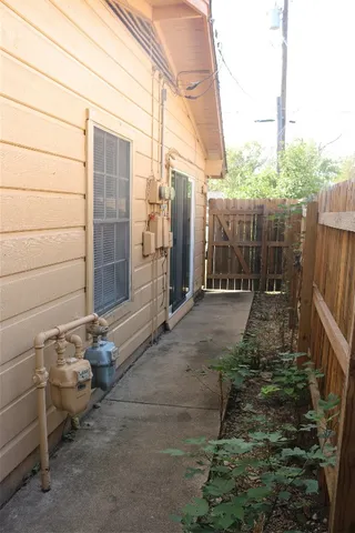 a view of a chair and table in backyard