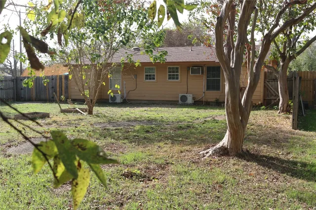 a backyard of a house with yard and outdoor seating