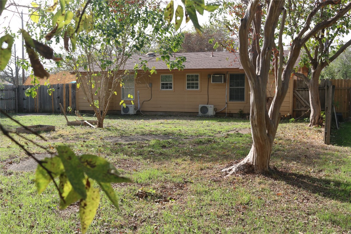 1705 Walnut Street, Unit 3 Georgetown, TX 78626 - Photo 20 of 21 a backyard of a house with yard and outdoor seating