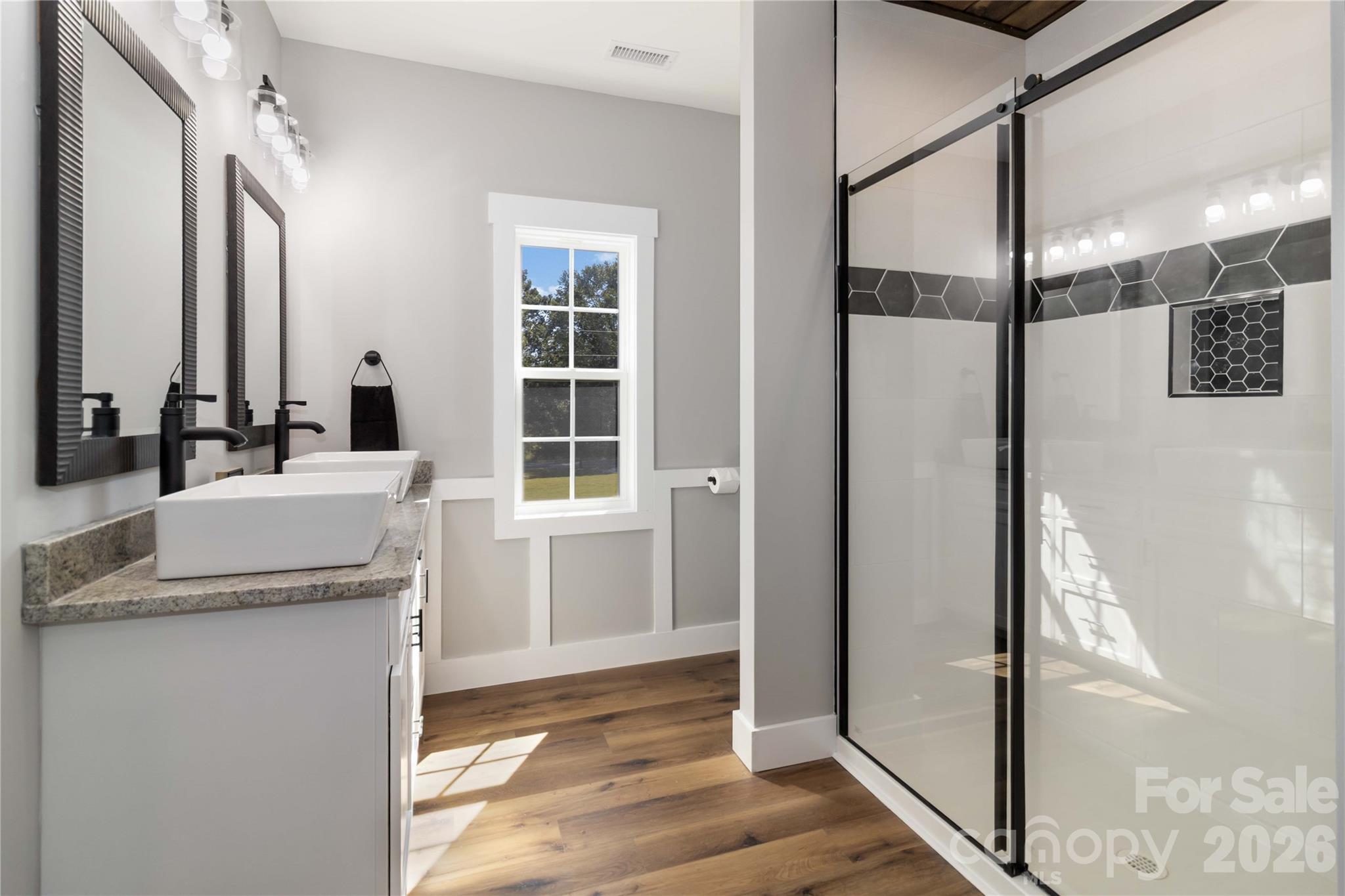 2605 Mt Prospect Road Chester, SC 29706 - Photo 24 of 35 a bathroom with a granite countertop sink and a mirror