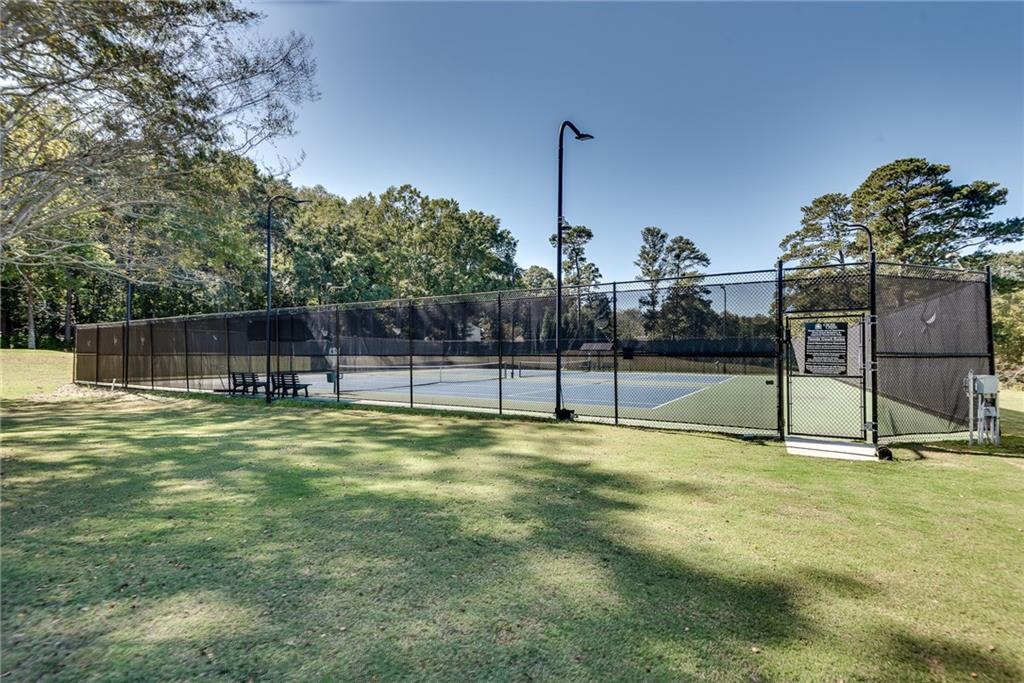 134 Lablanc Way Northwest Atlanta, GA 30327 - Photo 34 of 42 a swimming pool with some trees in the background