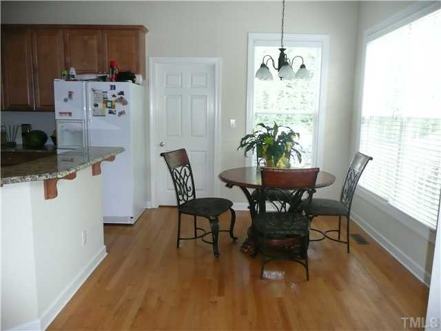 Hardwoods grace the breakfast room and plenty of windows allow you to look out at the serene backyard. Breakfast Area