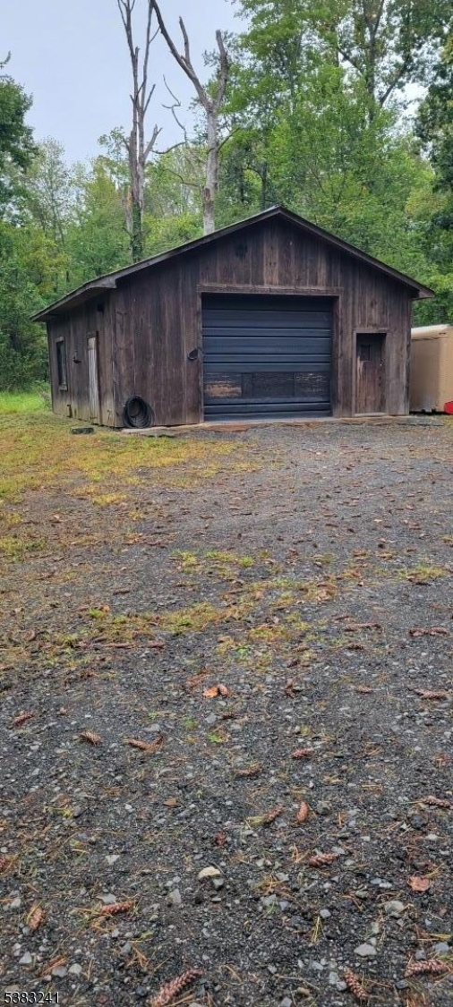 13 Ridge Road Hopewell, NJ 08525 - Photo 7 of 8 a front view of a house with a yard and garage