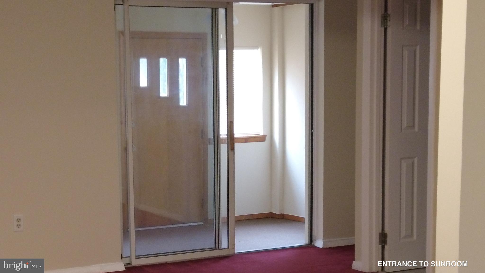 3901 92nd Avenue Springdale, MD 20774 - Photo 11 of 48 Entrance to Sunroom