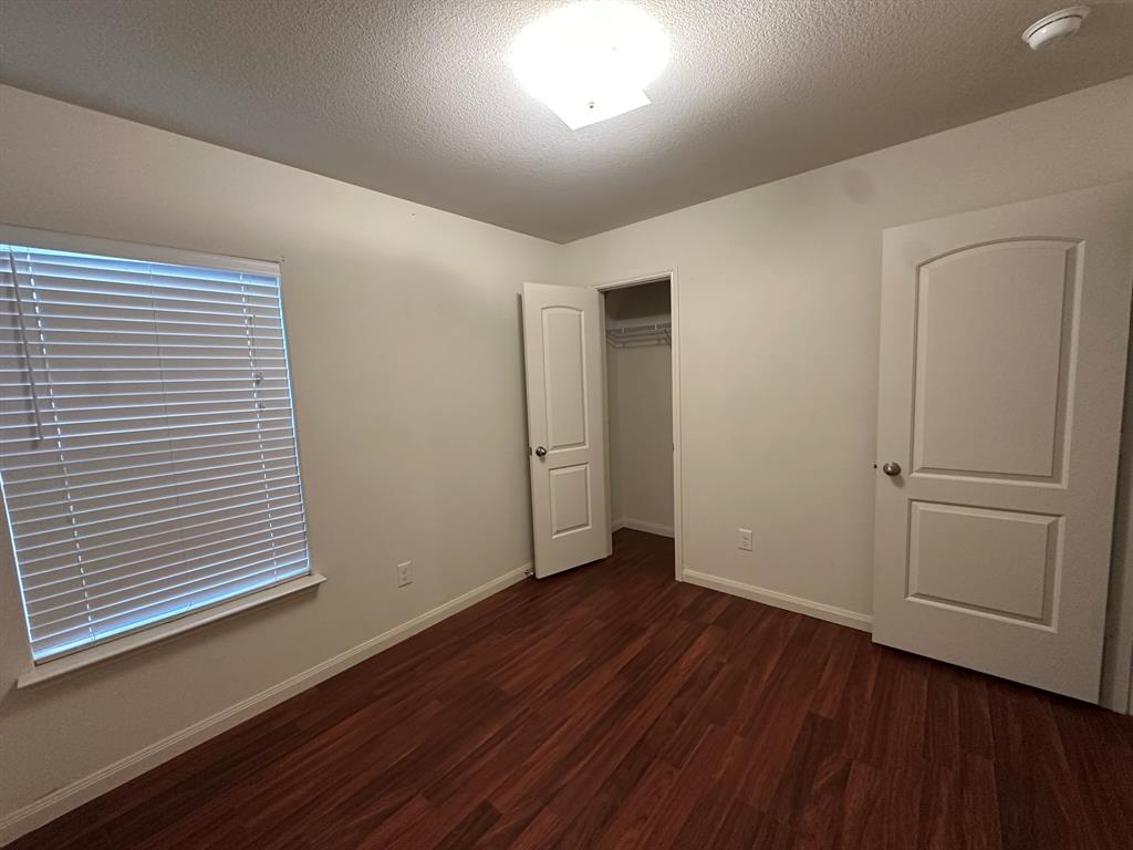 1818 Clegg Street Howe, TX 75459 - Photo 7 of 34 Room featuring wood-finish flooring, neutral wall tones, and white trim