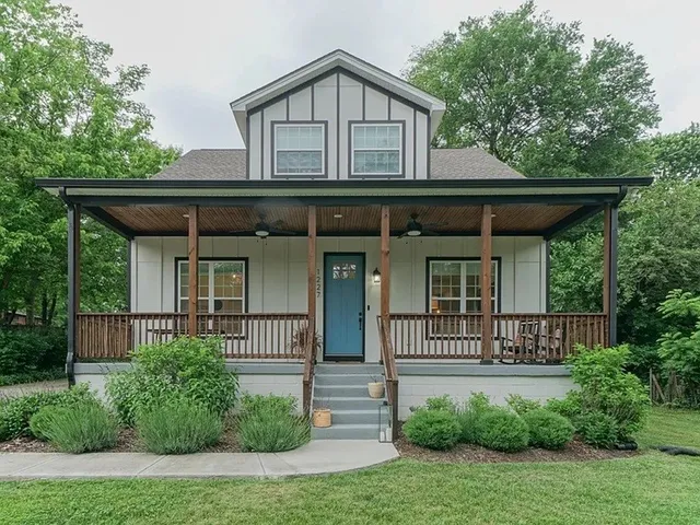 a front view of a house with garden