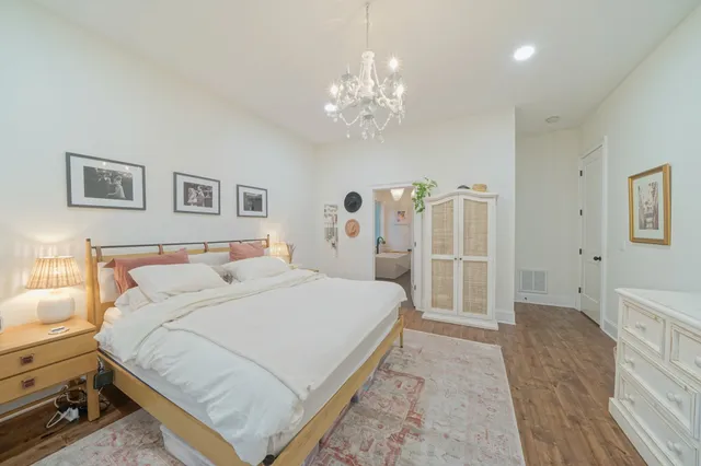 a large white kitchen with refrigerator a sink and dishwasher